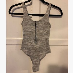 One piece tank top with zipper.